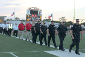 First responders walk onto the field during the 9/11 ceremony to applause and a standing ovation.