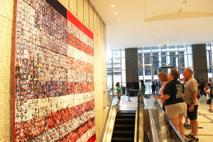 Supporters gaze at a 9/11 memorial quilt that features photos of those killed in the terrorist attacks.