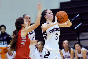 Raygan Cook gets ready to shot from midcourt as the first period expires against Ponder.