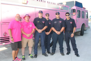 Firefighters join together in the Pink Heals tour at the Princeton Walmart. From left is Don Hayworth, Shawn Moseley, Steve Gammons,