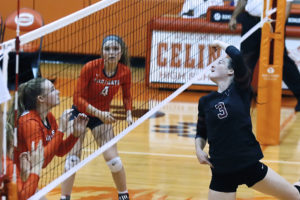 BriAna Lacey tips the ball over the net last Tuesday during a District 11-4A match at Celina. The Lady Panthers lost 21-25, 17-25, 17-25.