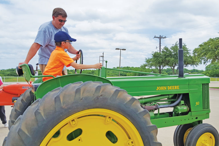 Teaching kids history through tractors, handson learning at Farm